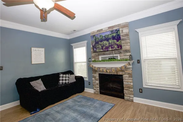 a living room with furniture and a fireplace