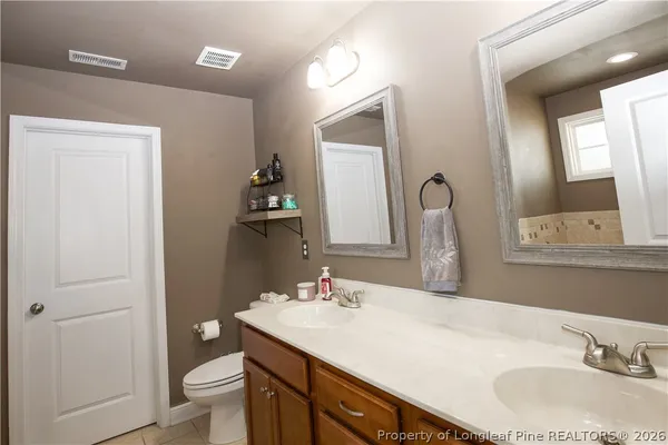 a bathroom with a bathtub and a window