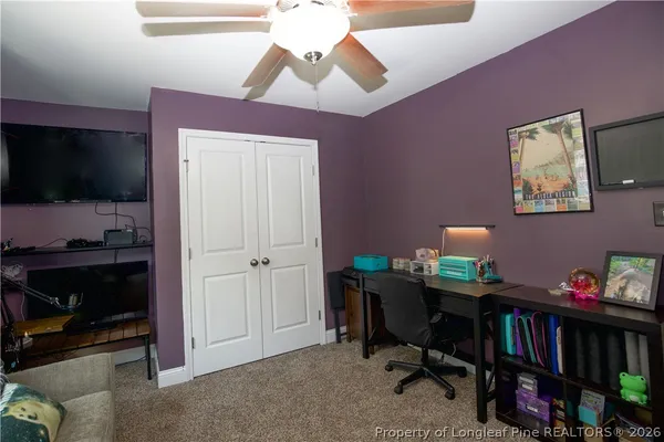 a room with furniture and a flat screen tv