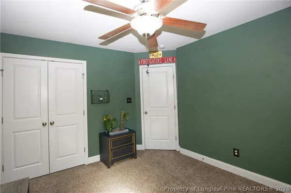 a room with window and a chandelier