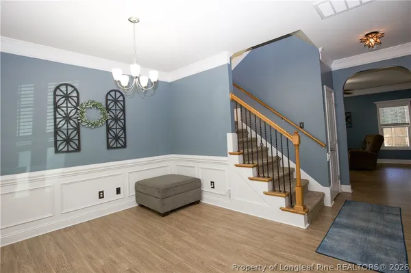 a view of a hallway with stairs