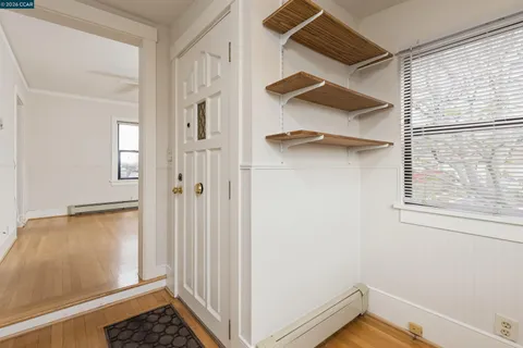 a view of a room that has a bed and a window