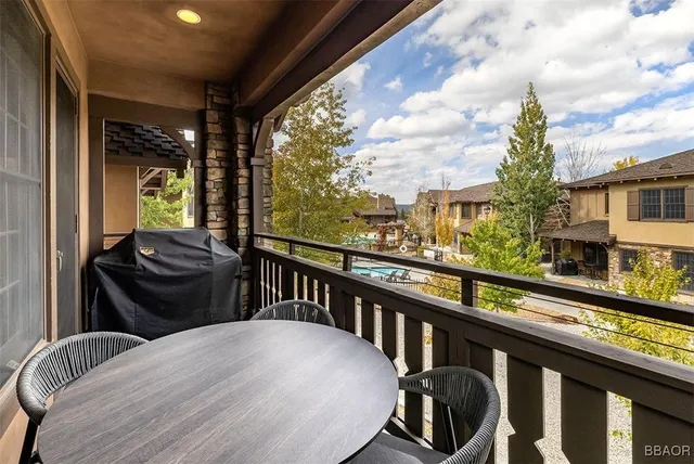 a view of a balcony with chairs