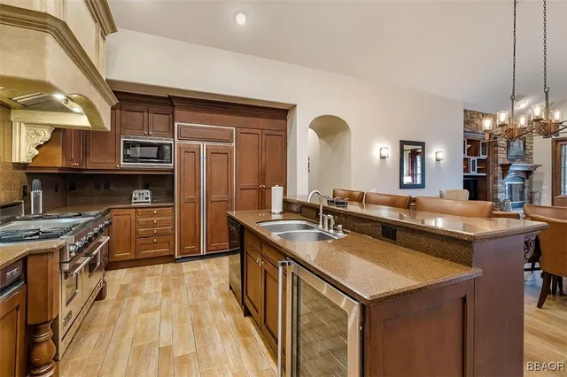 a kitchen with a sink stove and cabinets