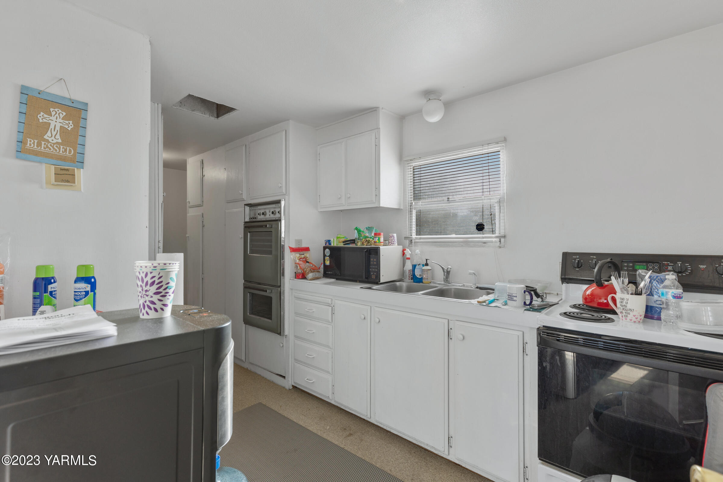 1331 Puterbaugh Road Grandview, WA 98930 - Photo 15 of 18 a kitchen with a sink cabinets and appliances