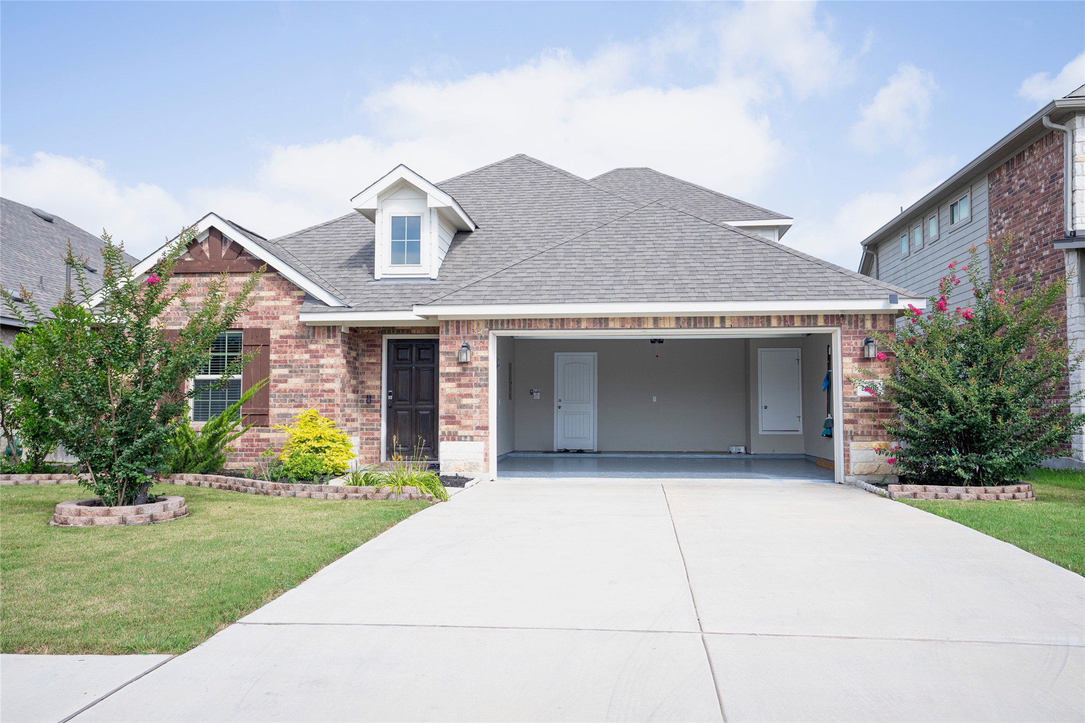 20916 Carries Ranch Road Pflugerville, TX 78660 - Photo 3 of 40 a front view of a house with a yard and garage