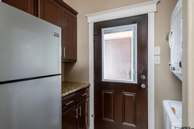 a view of a kitchen from the hallway