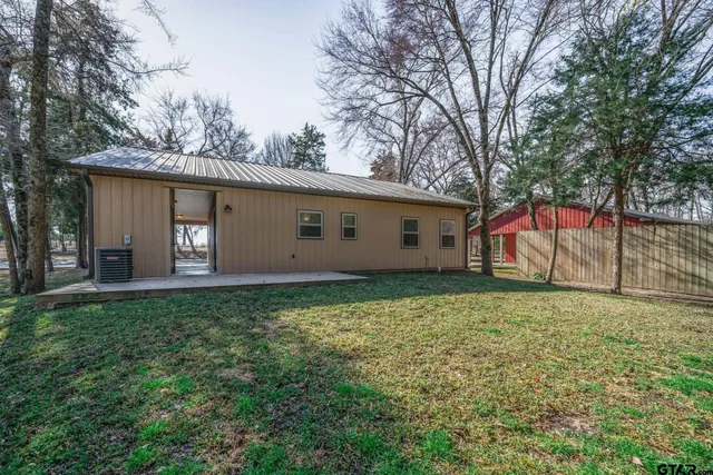 a backyard of a house with lots of green space