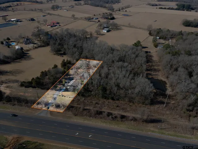 an aerial view of residential house with outdoor space