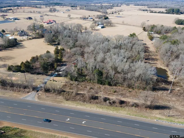 an aerial view of house with yard