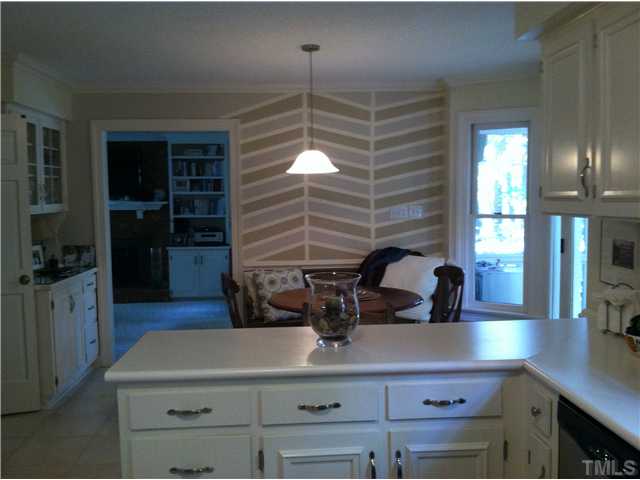 10212 Whitestone Road Raleigh, NC 27615 - Photo 11 of 15 a kitchen with a sink and a refrigerator