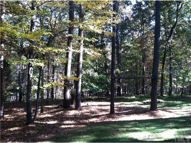 10212 Whitestone Road Raleigh, NC 27615 - Photo 14 of 15 a view of a park with tree s