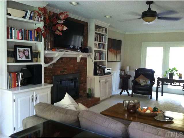 10212 Whitestone Road Raleigh, NC 27615 - Photo 3 of 15 a living room with furniture and a fireplace