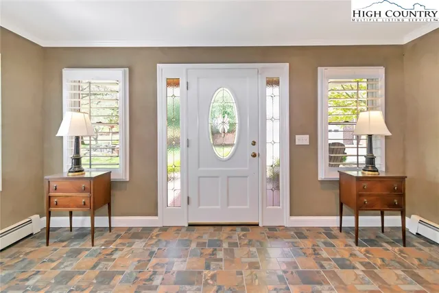 a view of a livingroom with furniture and a window