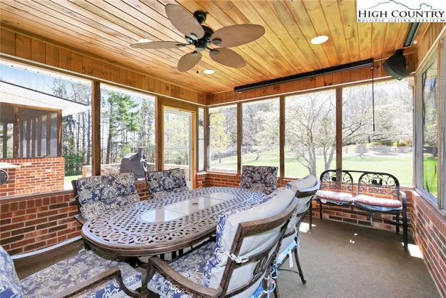 a indoor dining space with furniture and outdoor view