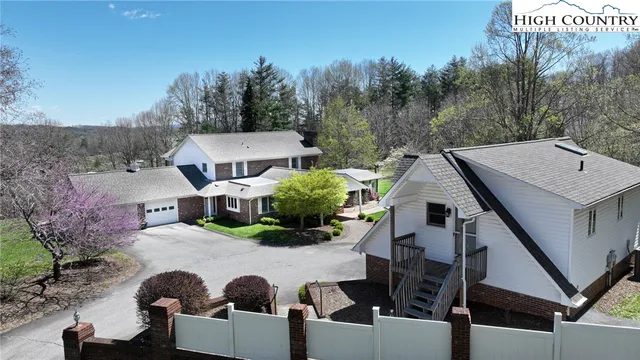 a view of balcony with table and chairs