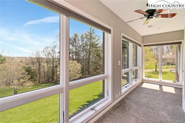 a view of a room with a large window