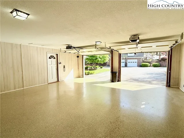 a view of a room with furniture and a window