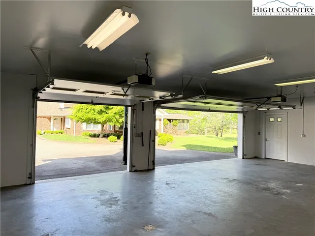 a view of an empty room and a window