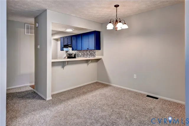 a view of a kitchen with a sink cabinets and a window