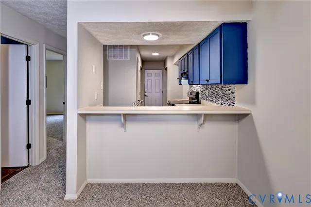 a view of a kitchen with a sink