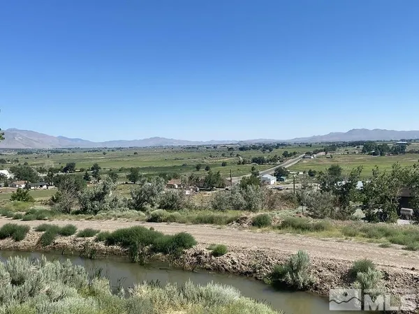 a view of a mountain with sunset view