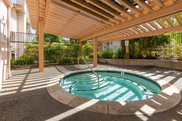 a view of a park with plants and a bench