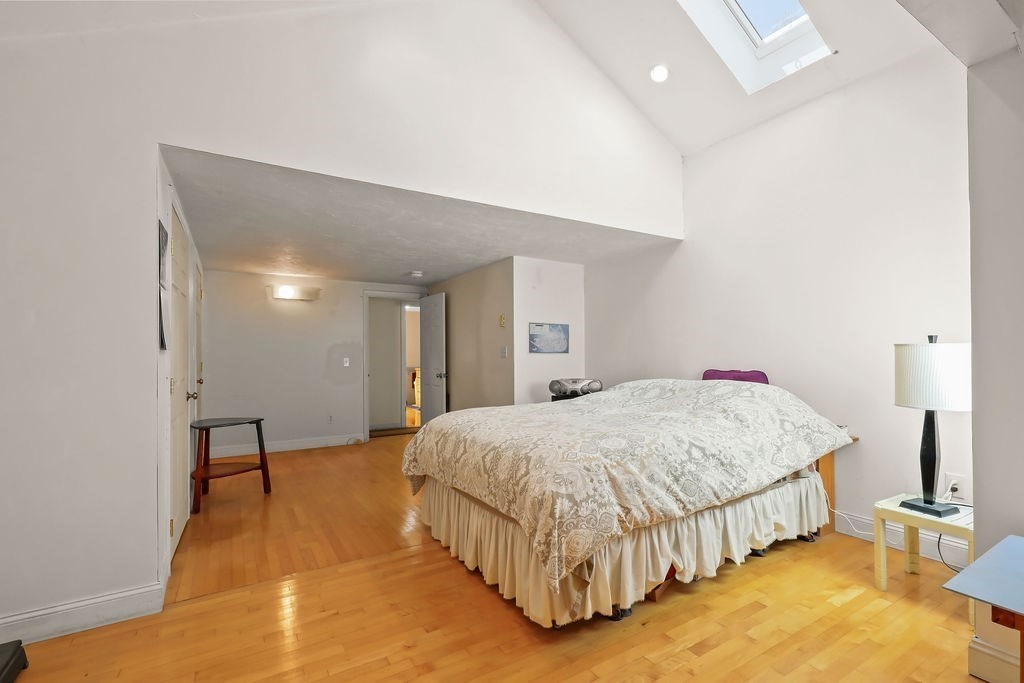 94 Fearing Hill Road Wareham, MA 02576 - Photo 9 of 41 a bedroom with a bed and chair