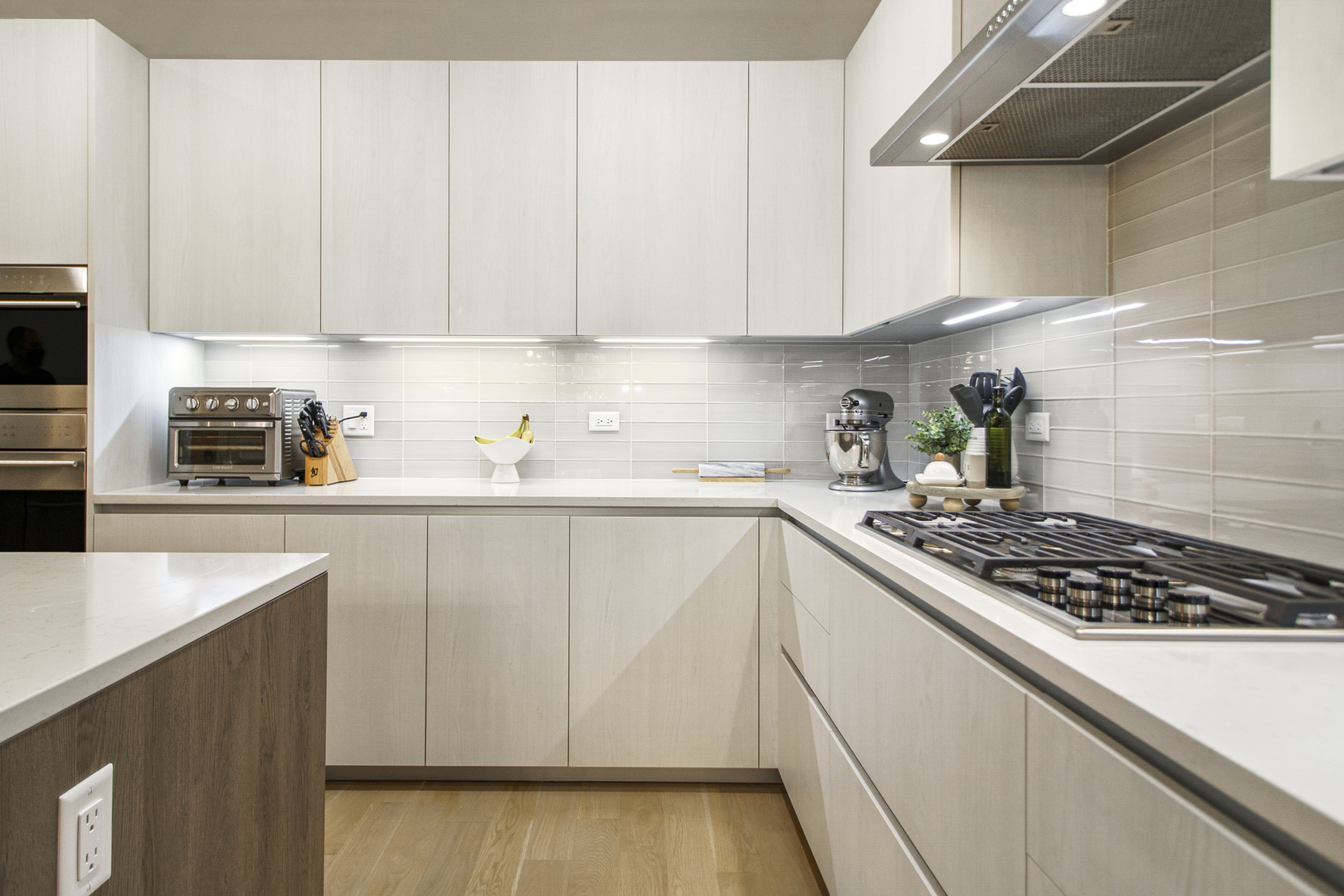 226 South Green Street, Unit 2N Chicago, IL 60607 - Photo 11 of 29 a kitchen with white cabinets and appliances