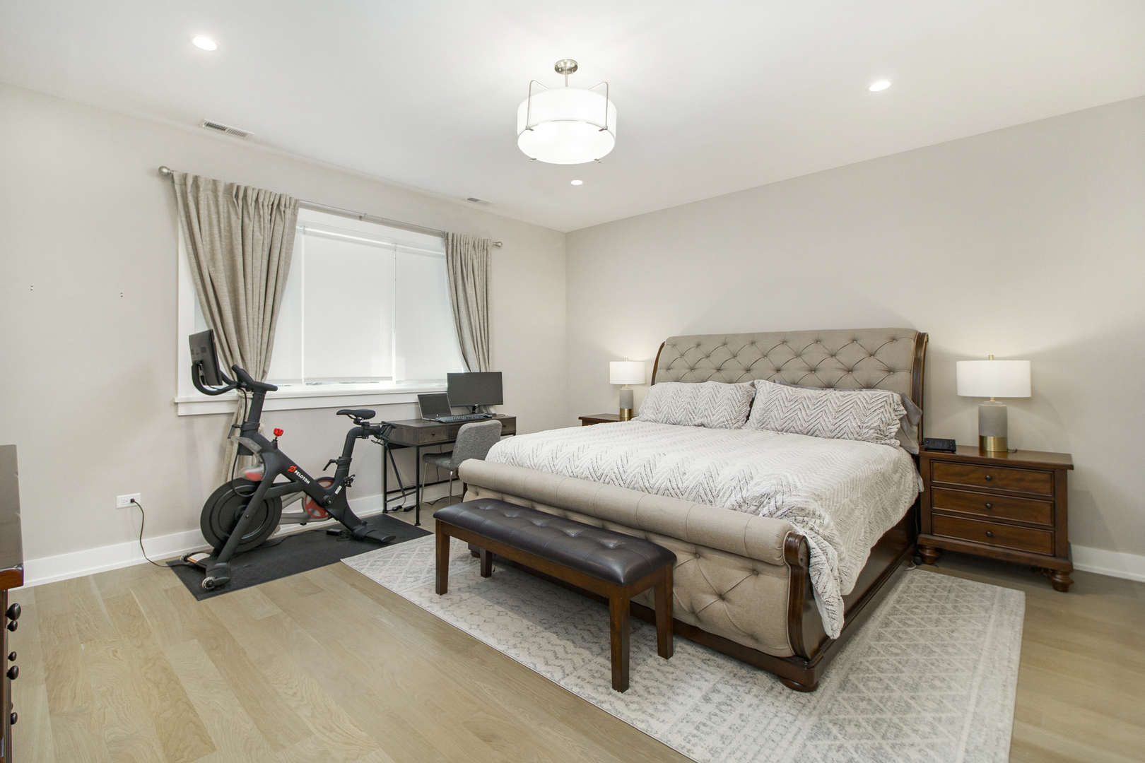 226 South Green Street, Unit 2N Chicago, IL 60607 - Photo 14 of 29 a bedroom with a bed chair and a chandelier