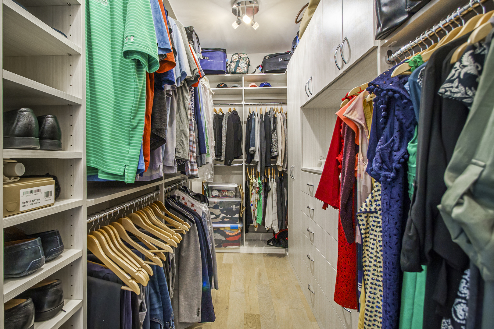 226 South Green Street, Unit 2N Chicago, IL 60607 - Photo 16 of 29 a view of walk in closet with clothes and shoes