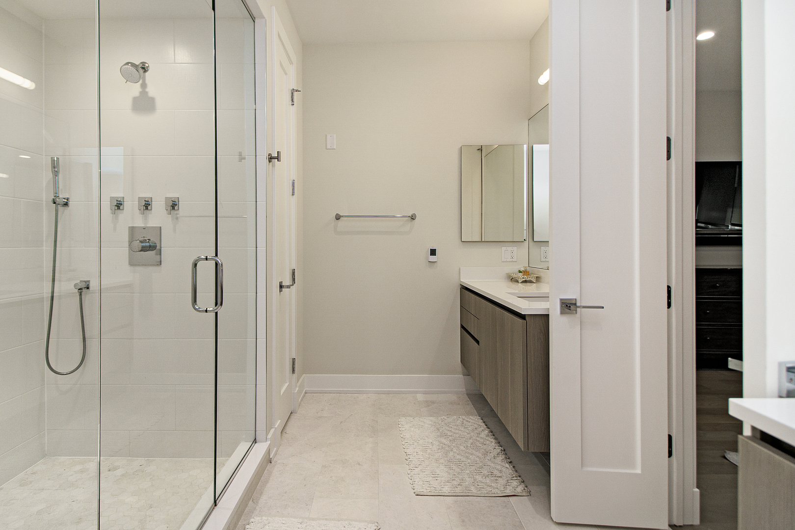 226 South Green Street, Unit 2N Chicago, IL 60607 - Photo 17 of 29 a bathroom with a double vanity sink and shower