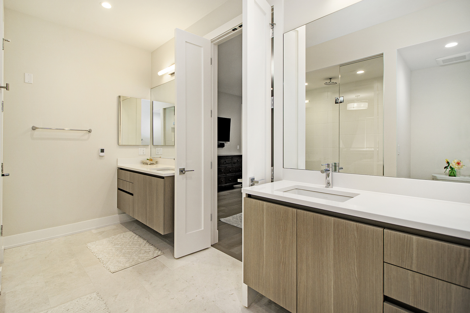 226 South Green Street, Unit 2N Chicago, IL 60607 - Photo 19 of 29 a spacious bathroom with a granite countertop sink a mirror and a bathtub