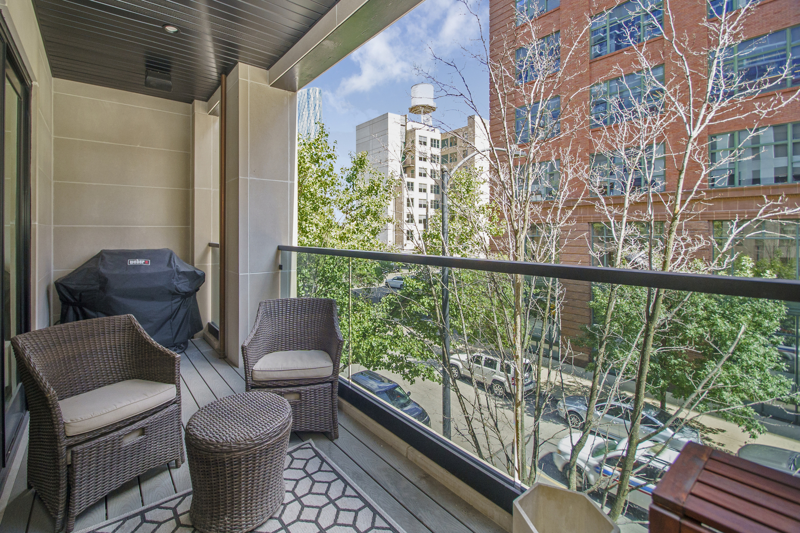 226 South Green Street, Unit 2N Chicago, IL 60607 - Photo 21 of 29 a view of a balcony with chair and wooden floor