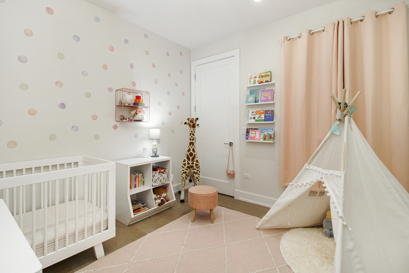 226 South Green Street, Unit 2N Chicago, IL 60607 - Photo 25 of 29 a living room with baby crib and a couch