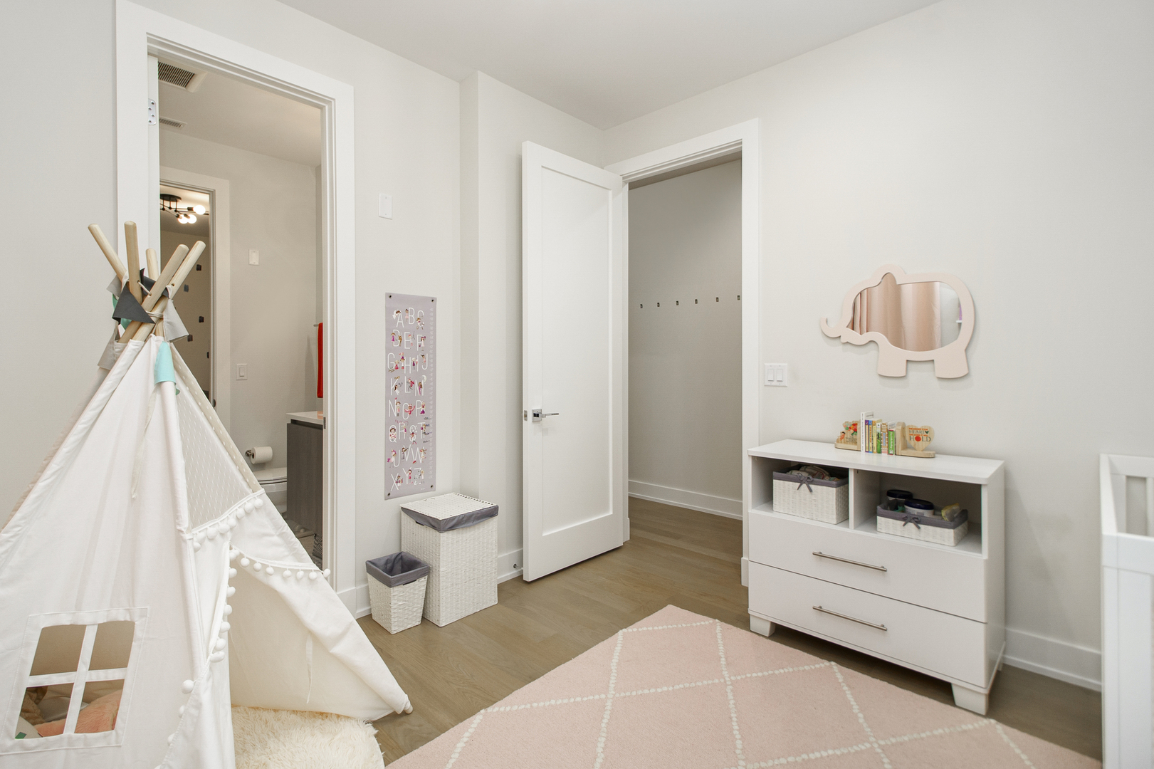 226 South Green Street, Unit 2N Chicago, IL 60607 - Photo 26 of 29 a room with a baby crib and dresser