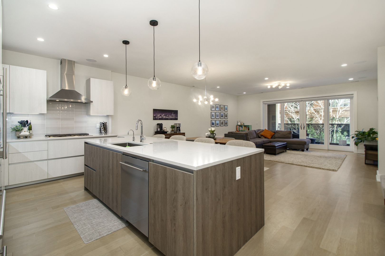 226 South Green Street, Unit 2N Chicago, IL 60607 - Photo 8 of 29 a kitchen with stainless steel appliances granite countertop a sink a stove and a wooden floors