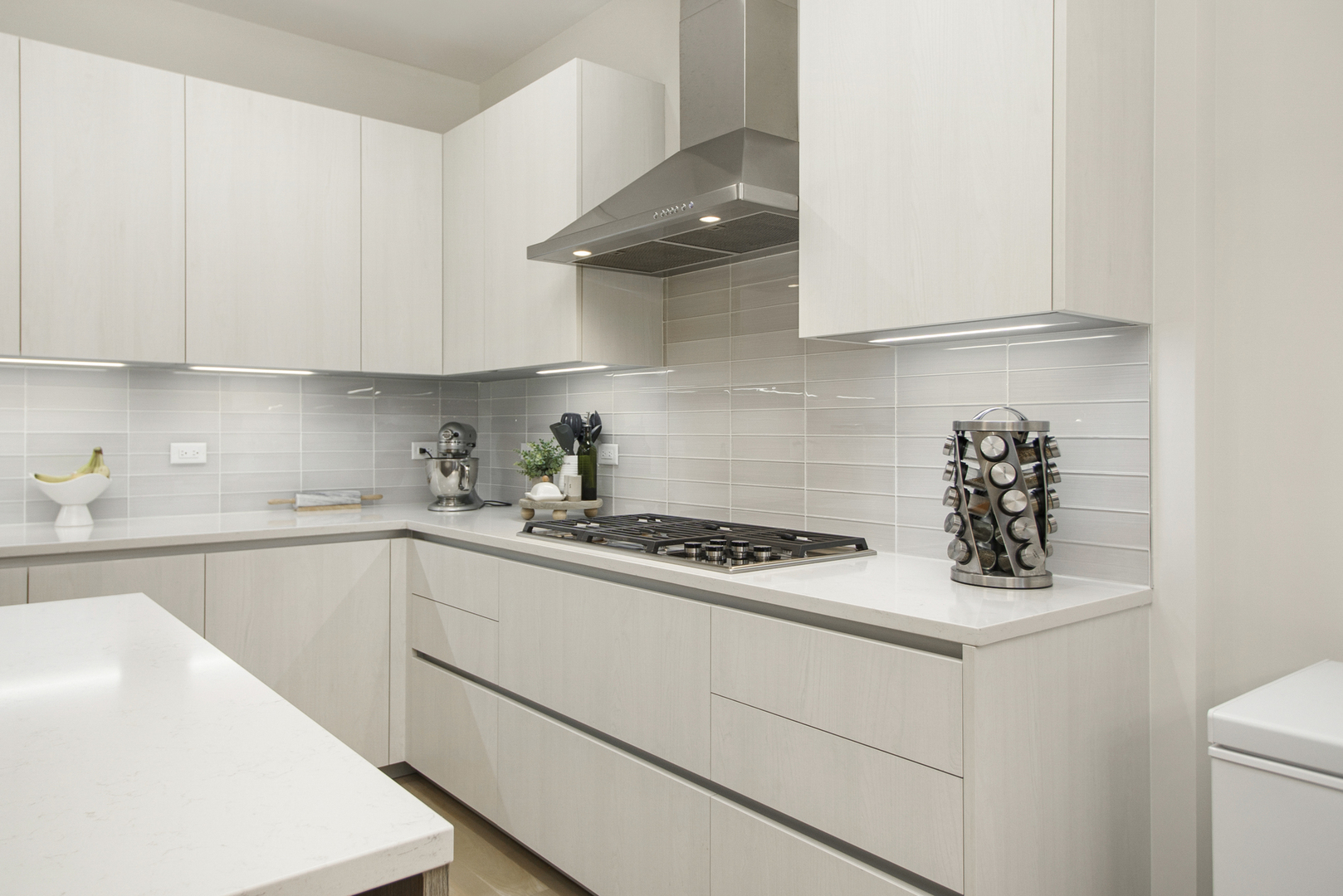 226 South Green Street, Unit 2N Chicago, IL 60607 - Photo 10 of 29 a kitchen with white cabinets and white appliances