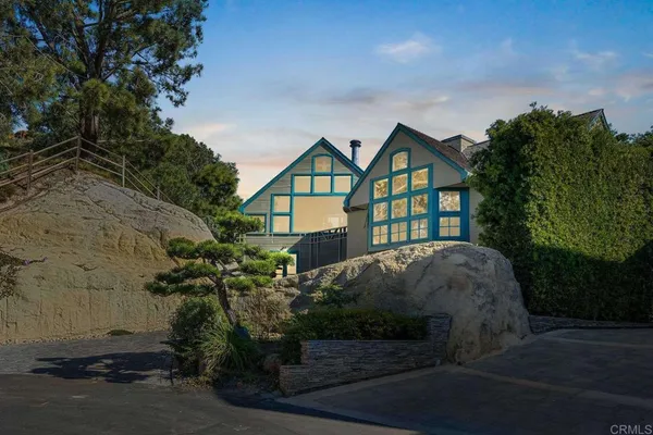 a house with trees in the background