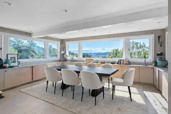 a dining room with furniture and window