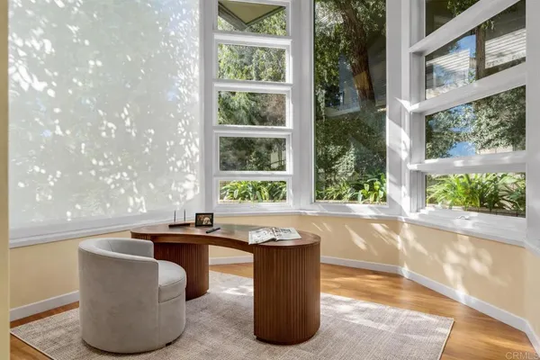 a dining table sitting next to a window