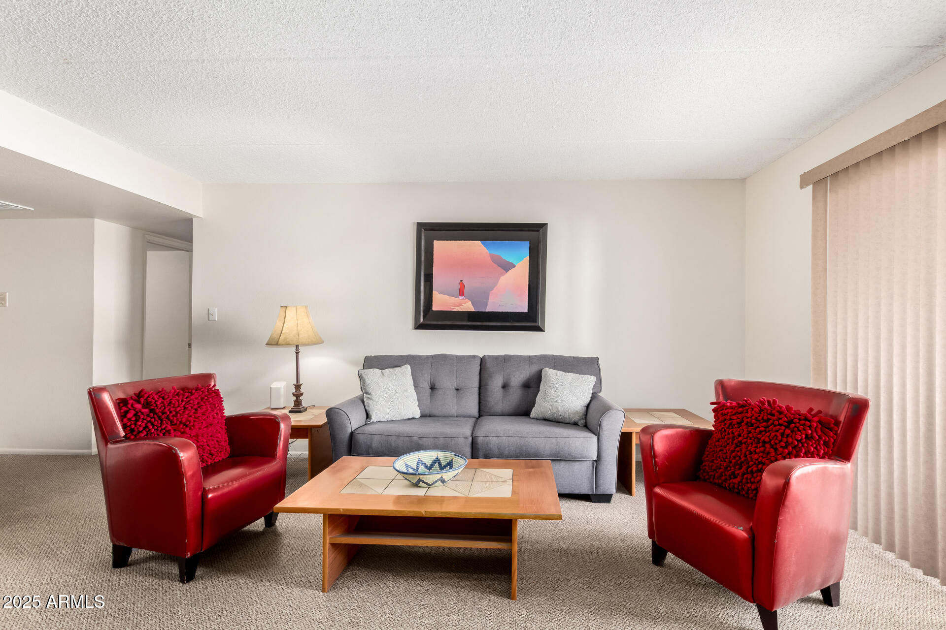 7920 East Camelback Road, Unit 608 Scottsdale, AZ 85251 - Photo 2 of 16 a living room with furniture a couch and painting on the wall