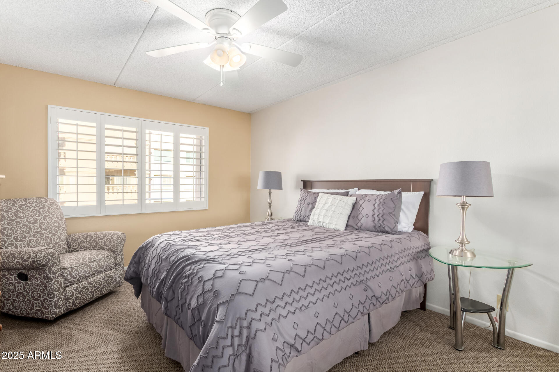 7920 East Camelback Road, Unit 608 Scottsdale, AZ 85251 - Photo 7 of 16 a bedroom with a bed and a couch