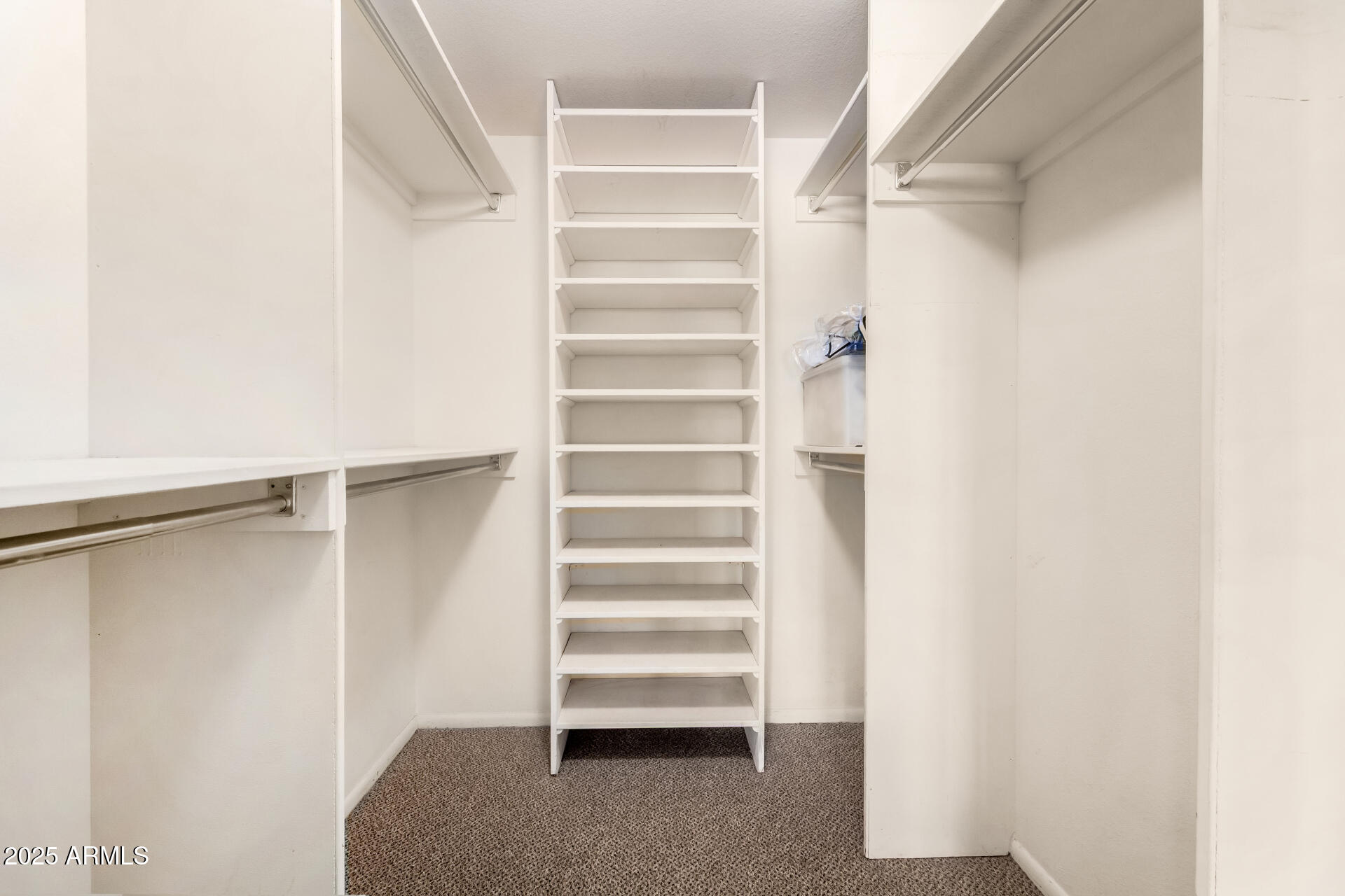 7920 East Camelback Road, Unit 608 Scottsdale, AZ 85251 - Photo 10 of 16 a view of walk in closet with empty racks