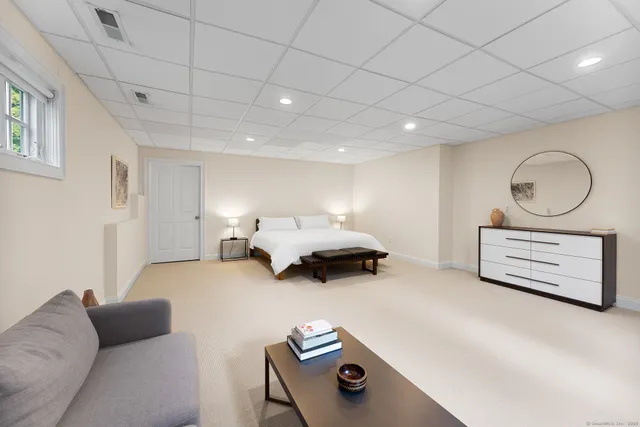 a bedroom with furniture and a couch