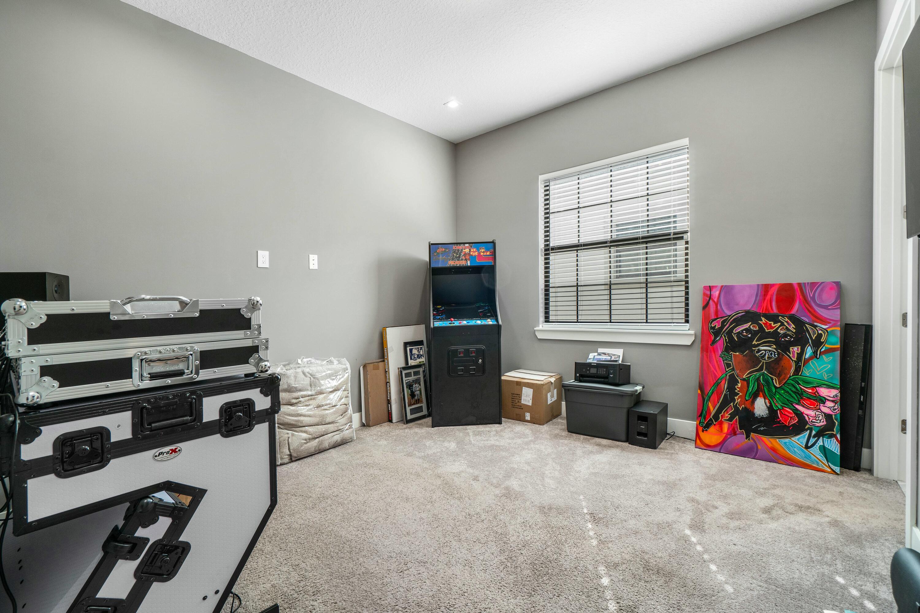 2928 Gin Berry Way West Palm Beach, FL 33401 - Photo 17 of 32 a living room with furniture a flat screen tv and a fireplace