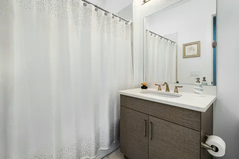 a bathroom with a double vanity sink and mirror