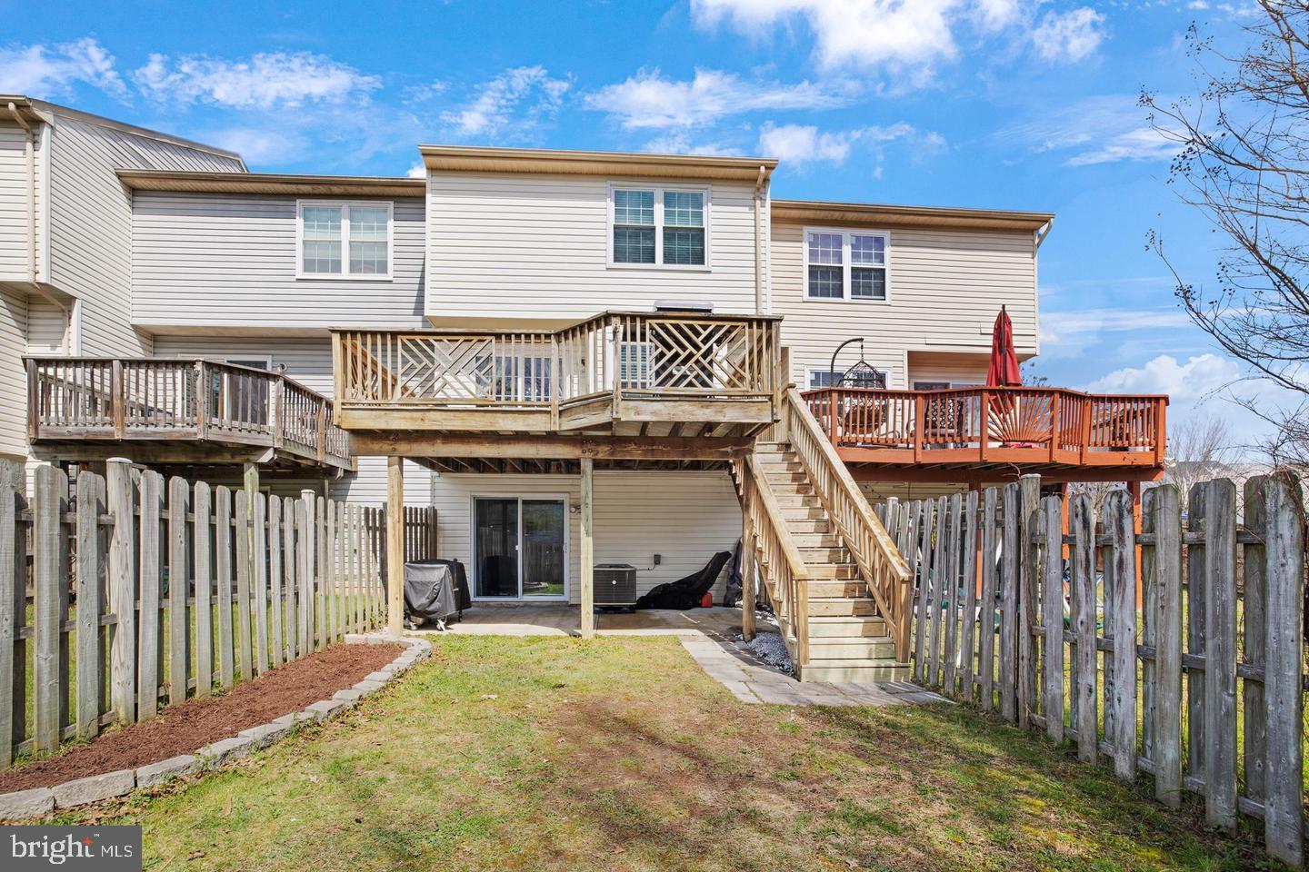 202 Mulberry Ridge Court Pasadena, MD 21122 - Photo 2 of 6 a view of a house with wooden floor and a fence