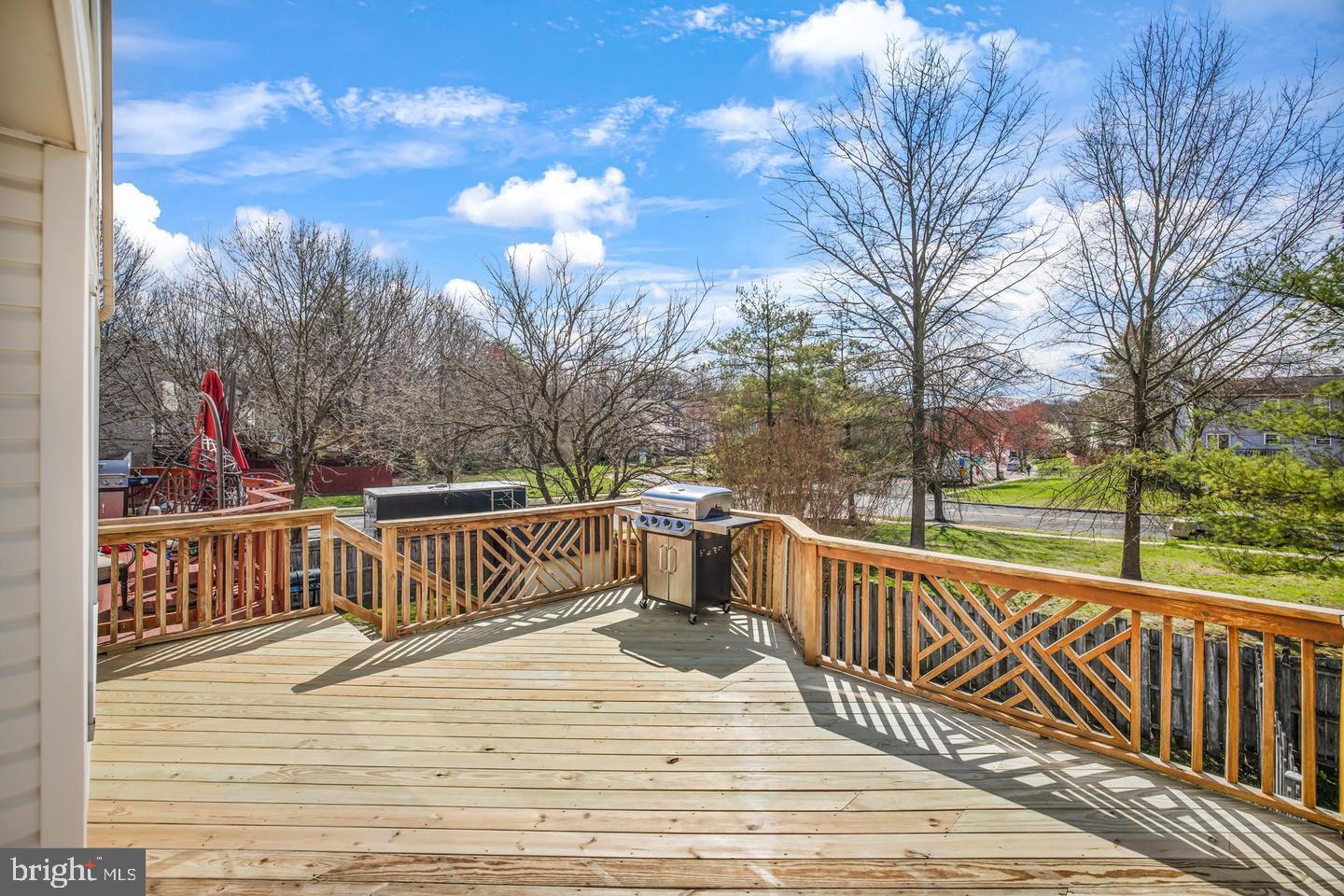 202 Mulberry Ridge Court Pasadena, MD 21122 - Photo 5 of 6 a view of a deck with a yard