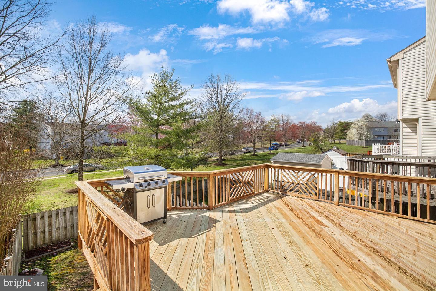 202 Mulberry Ridge Court Pasadena, MD 21122 - Photo 6 of 6 a view of balcony with wooden floor and fence